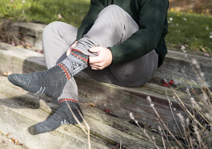 What are the benefits of socks made from natural materials?
